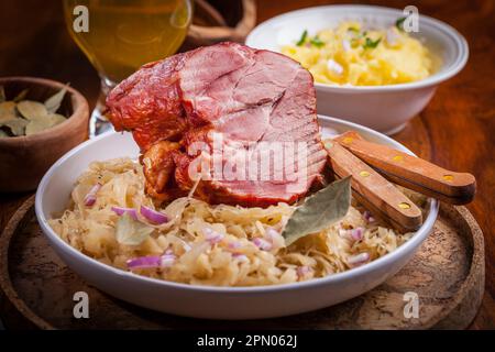 Smoked pork with cabbage (Sauerkraut) and beer Stock Photo