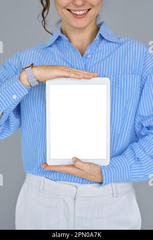 Business woman model holding digital tablet computer showing mock up screen. Stock Photo