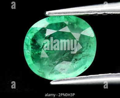 Natural gem green emerald on black background Stock Photo