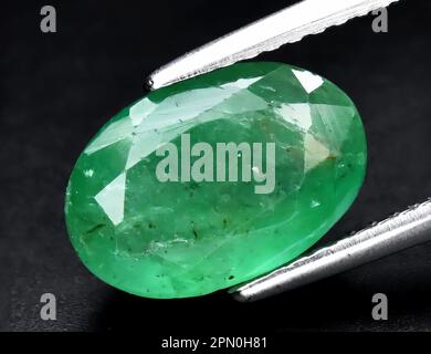 Natural gem green emerald on black background Stock Photo