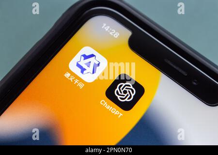 Vancouver, CANADA - Apr 15 2023 : Tongyi Qianwen, an AI language model developed by Alibaba Group, and ChatGPT icons seen in an iPhone screen. Stock Photo