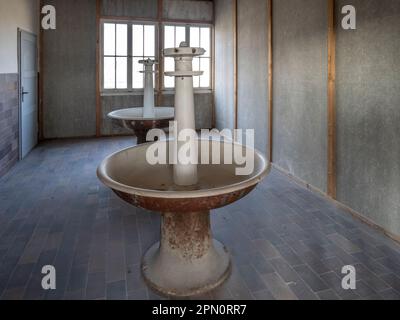 wash room inside the barracks at the Dachau Concentration Camp Stock Photo