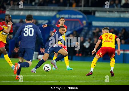 Paris, France. 15th Apr, 2023. Paris Saint Germain's Kylian Mbappe (C) breaks through during a French Ligue 1 football match between Paris Saint Germain (PSG) and RC Lens in Paris, France, April 15, 2023. Credit: Glenn Gervot/Xinhua/Alamy Live News Stock Photo