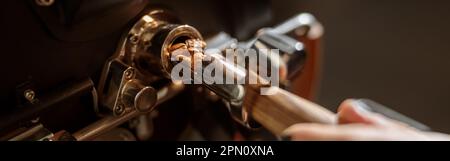 Male worker using professional coffee roasting machine Stock Photo