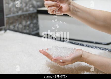 sea salt heap in hands. Rock salt, salt flakes, Nin, Croatia. Salt works. Nature sea salt Stock Photo