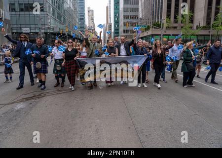 NEW YORK, NEW YORK - APRIL 15: Participants march at the 25th Annual Tartan Day Parade in Manhattan on April 15, 2023 in New York City. Stock Photo