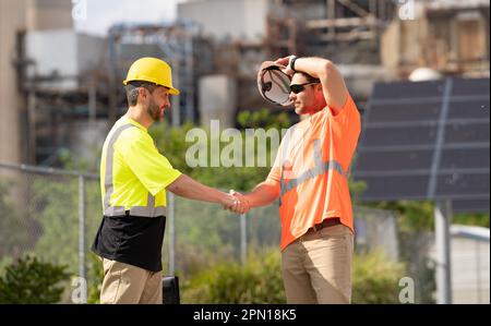 image of construction supervisor handshaking deal. construction supervisor handshaking deal. Stock Photo