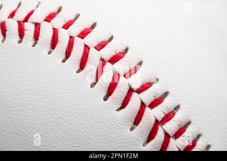 Texture of a white baseball with a red seam Stock Photo