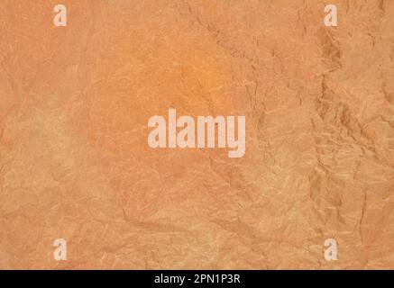 Brown crumpled baking paper as a background Stock Photo