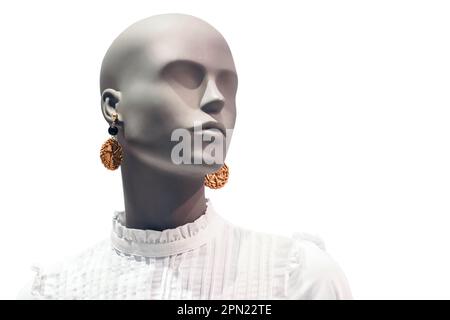 Portrait of mannequin. Woman profile face in store window. Isolated bald dummy. Shopping, beauty or feminine concept. Copy space for text Stock Photo