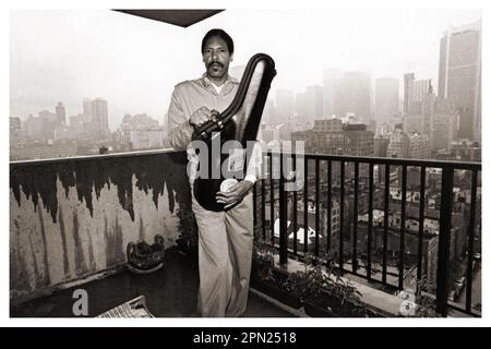 A posed 1984 portrait of avant garde jazz saxophonist Frank Lowe posing on his balcony in Midtown Manhattan. Stock Photo