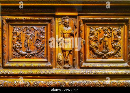 Toronto, Canada - April 7, 2023: Mannerist style in crafted wood cabinet from 1500s. The object is part of an exhibit in the Royal Ontario Museum. Stock Photo