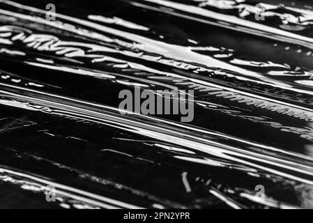 Plastic stretch wrap on black background Stock Photo