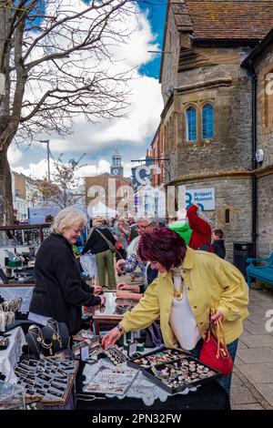 Bridport Saturday street market on a sunny Springtime morning, with the town clock and Bucky Do Square in the background. Concept Street Markets. Stock Photo