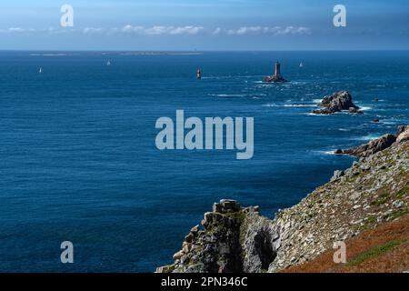 Spectacular Cliffs And Lighthouse At Peninsula Pointe Du Raz At The Finistere Atlantic Coast In Brittany, France Stock Photo