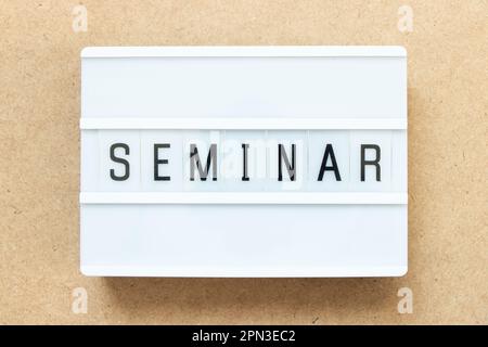 Lightbox with word seminar on wood background Stock Photo