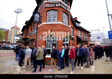 Fans queue outside of the Trent Bridge Inn pub ahead of the Premier League match at the City Ground, Nottingham. Picture date: Sunday April 16, 2023. Stock Photo