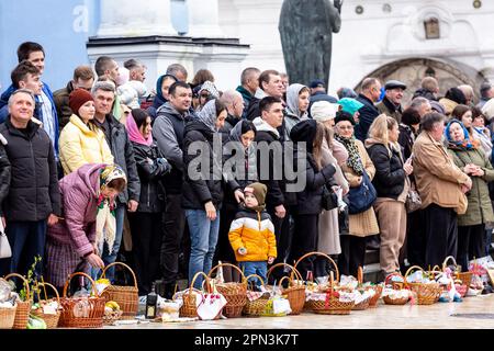 Ukrainian believers attend the Easter Sunday traditional celebration in St. Michael's Golden-Domed Monastery in central Kyiv, the capital of Ukraine on April 16, 2023. According to the tradition the faithful bring their Easter food in a basket to be purified, it always is Pasha (Easter bread), painted egg (pysanka) among other. Most of Ukrainians are Orthodox Christians or Greek Catholic Christians, both observe the eastern rite of Easter. Kyiv remains relatively peaceful as the Russian invasion continuous and Ukraine prepares for a spring counter-offensive to retake Ukrainian land occupied by Stock Photo