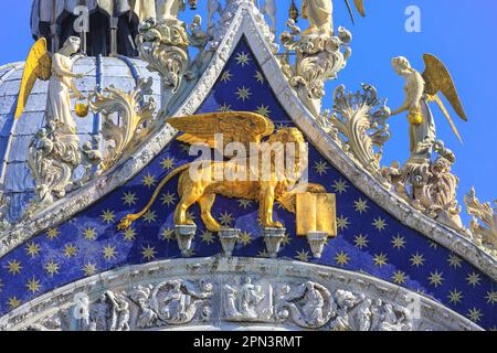 St Mark's Basilica Venice, detail of golden lion, mosaics and angel statues on the roof, church attached to the Doge's Palace, Venezia, Italy, Europe Stock Photo