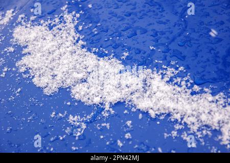 Ice on blue car glass in winter close up Stock Photo