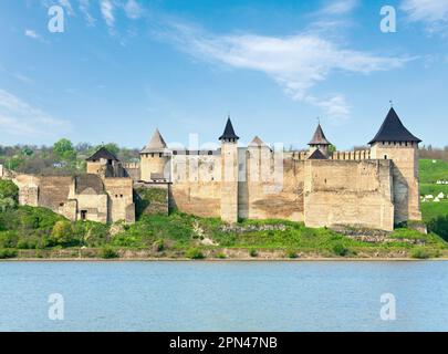 Spring view of Khotyn Fortress on Dniester riverside (Chernivtsi Oblast, Ukraine). Construction was started in 1325, while major improvements were mad Stock Photo
