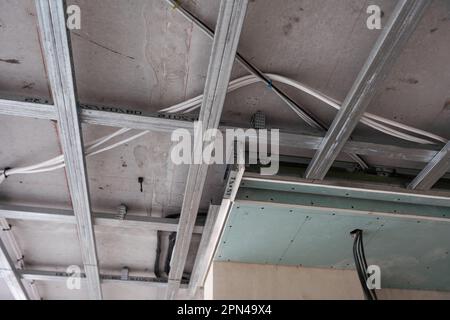 Installation of false ceiling of gypsum board Stock Photo - Alamy