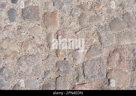Grey cobblestone with grit street pattern background Stock Photo