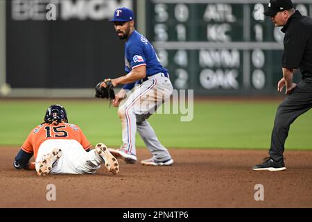 Houston Astros catcher Martin Maldonado (15) dives safely into second for a double in the Botton of the seventh inning during the MLB game between the Stock Photo