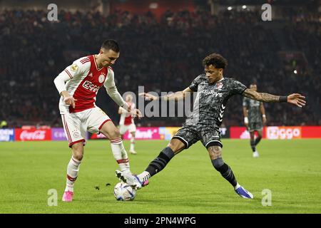 AMSTERDAM - (L-R) Steven Berghuis of Ajax, Jermy Antonisse of FC Emmen during the Dutch premier league match between Ajax Amsterdam and FC Emmen at the Johan Cruijff ArenA on April 16, 2023 in Amsterdam, Netherlands. ANP MAURICE VAN STONE Stock Photo