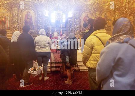 Ukrainian believers seen praying during the Easter Sunday celebrations in St. Michael's Golden-Domed Monastery in central Kyiv. According to the tradition the faithful bring their Easter food in a basket to be purified, it is always Pasha (Easter bread), painted egg (pysanka) among other. Most of Ukrainians are Orthodox Christians or Greek Catholic Christians, both observe the eastern rite of Easter. Kyiv remains relatively peaceful as the Russian invasion continuous and Ukraine prepares for a spring counter-offensive to retake Ukrainian land occupied by Russia. Stock Photo
