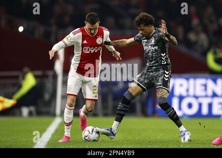 AMSTERDAM - (L-R) Steven Berghuis of Ajax, Jermy Antonisse of FC Emmen during the Dutch premier league match between Ajax Amsterdam and FC Emmen at the Johan Cruijff ArenA on April 16, 2023 in Amsterdam, Netherlands. ANP MAURICE VAN STONE Stock Photo