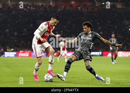 AMSTERDAM - (L-R) Steven Berghuis of Ajax, Jermy Antonisse of FC Emmen during the Dutch premier league match between Ajax Amsterdam and FC Emmen at the Johan Cruijff ArenA on April 16, 2023 in Amsterdam, Netherlands. ANP MAURICE VAN STONE Stock Photo