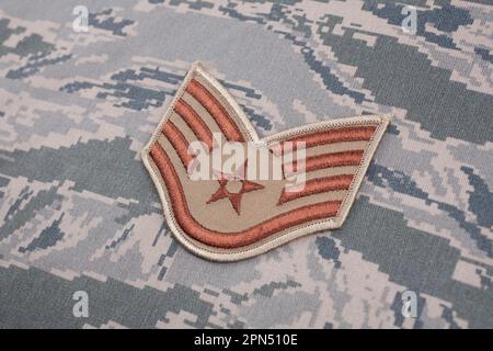 August 31, 2020. US AIR FORCE Staff Sergeant rank patch on digital tiger-stripe pattern Airman Battle Uniform (ABU) Stock Photo