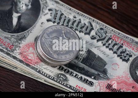 Old west period US banknotes and silver certificates with silver dollar coins Stock Photo