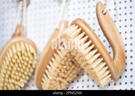 kitchen brushes hang in supermarket Stock Photo