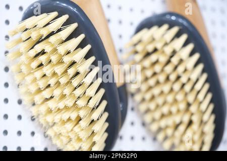 kitchen brushes hang in supermarket Stock Photo