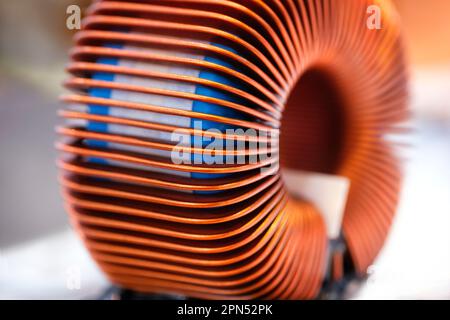 Close-up of toroidal and cylindrical coil, industrial concept background Stock Photo