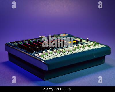 3D rendering of vintage audio mixer over violet background Stock Photo