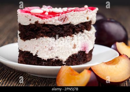 Delicious puff pastry with chocolate biscuits and berry flavor, delicious pastry with butter cream and fruit layer Stock Photo