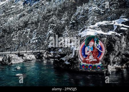 Painted stone carvings of Tibetan Buddha statues in the high mountains of Western Sichuan, China, very majestic Stock Photo