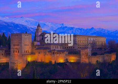 Alhambra, UNESCO World Heritage Site, Sierra Nevada and la Alhambra at dusk, Granada, Andalucia, Spain Stock Photo