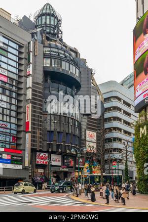 Tokyo, Japan - March 21, 2023: People walking along the busy streets and crossing at the famous Shibuya Crossing in Tokyo, Japan Stock Photo