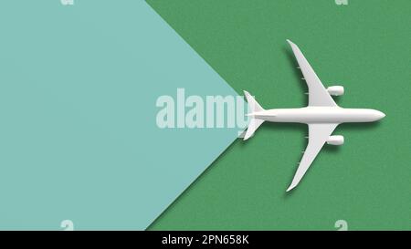 Top view white plane on green background transition Stock Photo