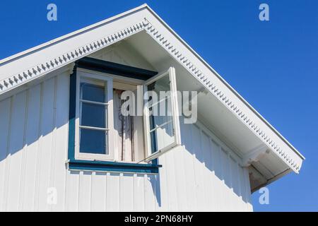 Open window in an old wooden cottage Stock Photo