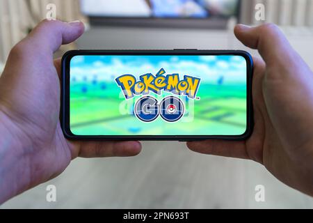 Woman sitting in a car and playing a Pokemon Go game Stock Photo - Alamy