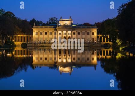 The Palace on the Isle illuminated by night in the Royal Lazienki Park in city of Warsaw, Poland. Summer residence of king Stanisław August Poniatowsk Stock Photo