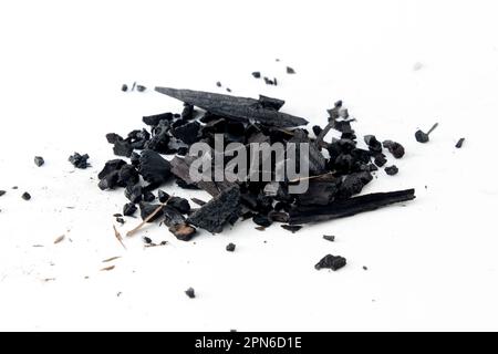 Black charcoal particles isolated on a white background, Activated charcoal powder Stock Photo