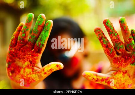 Holi color in girl's hands Stock Photo