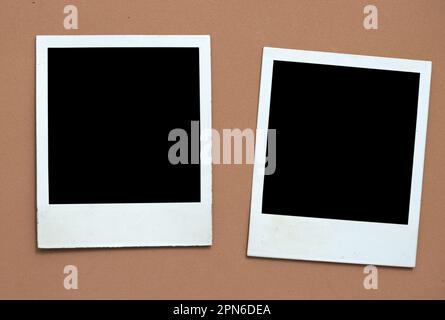 Photo frames on brown background Stock Photo
