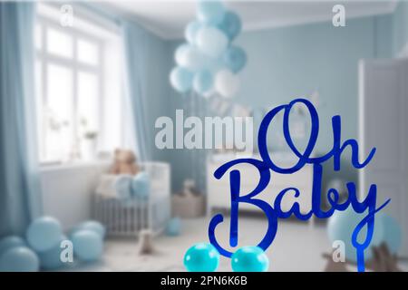 pregnancy announcement background with text Oh Baby in blue baby boy room. Greeting card, baby shower invitation, baby birth, blurred background Stock Photo